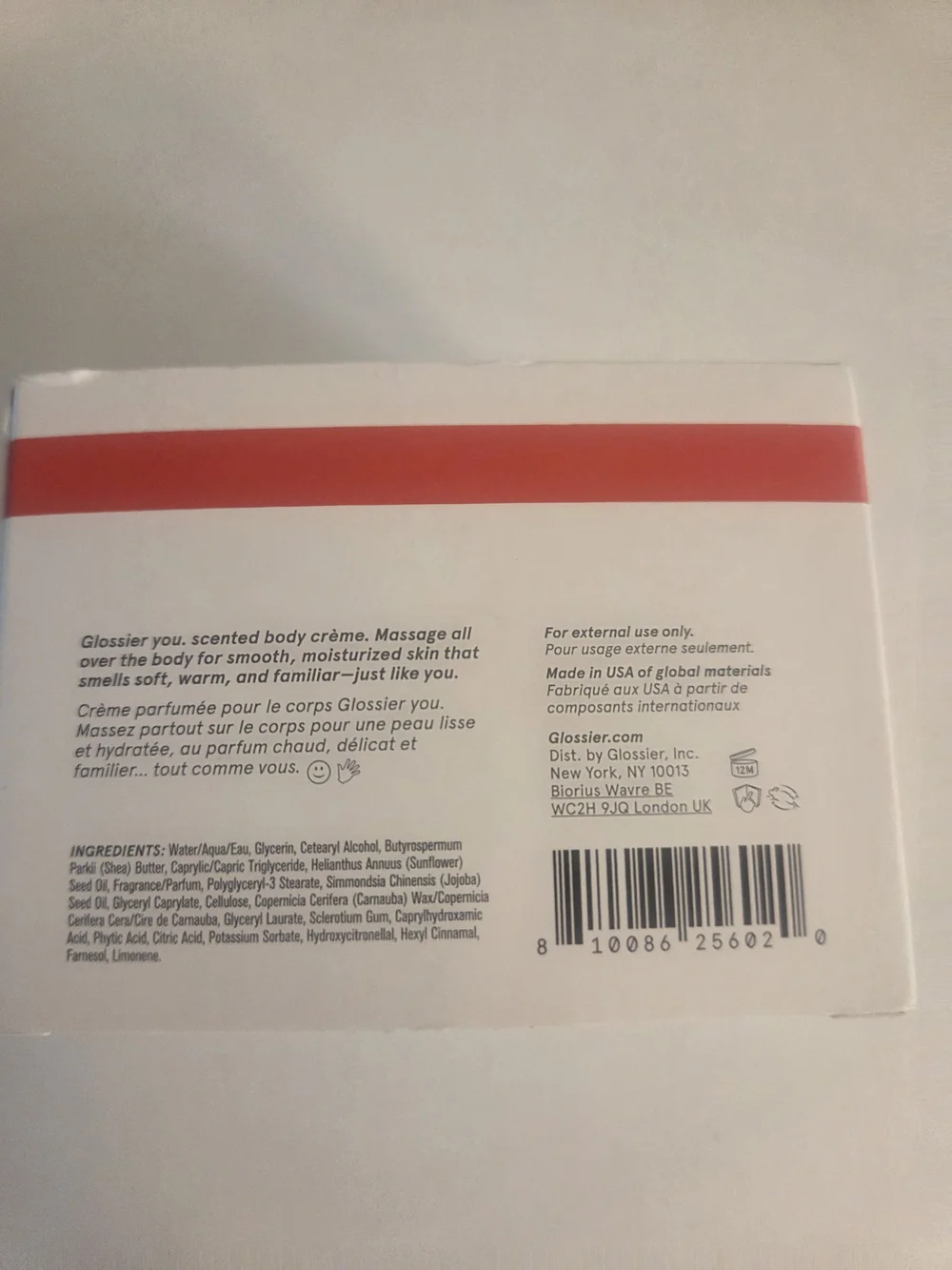 Glossier cream white with red stripe